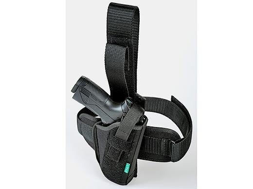 Universal holster for carrying a pistol on the leg for a left-handed person