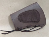 Natural leather cartridge holder on the buttstock for rifle ammunition